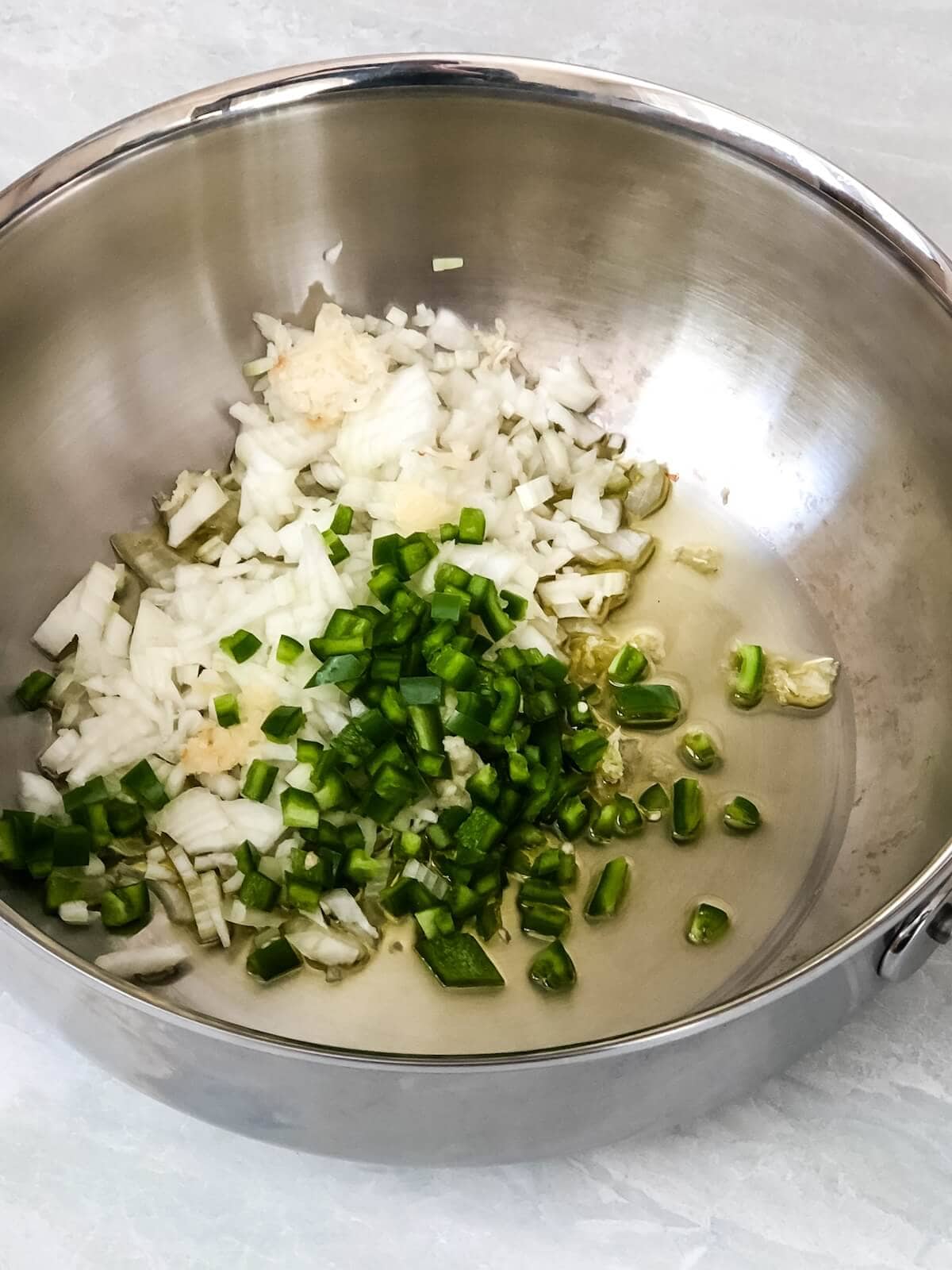 Saute garlic, onion and jalapeno before cooking black beans a second time.