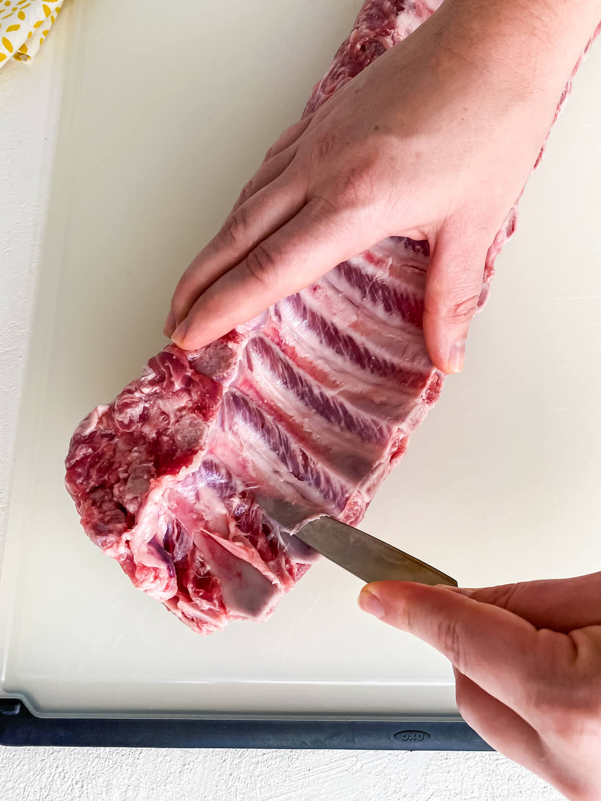 removing rib membrane with a pairing knife