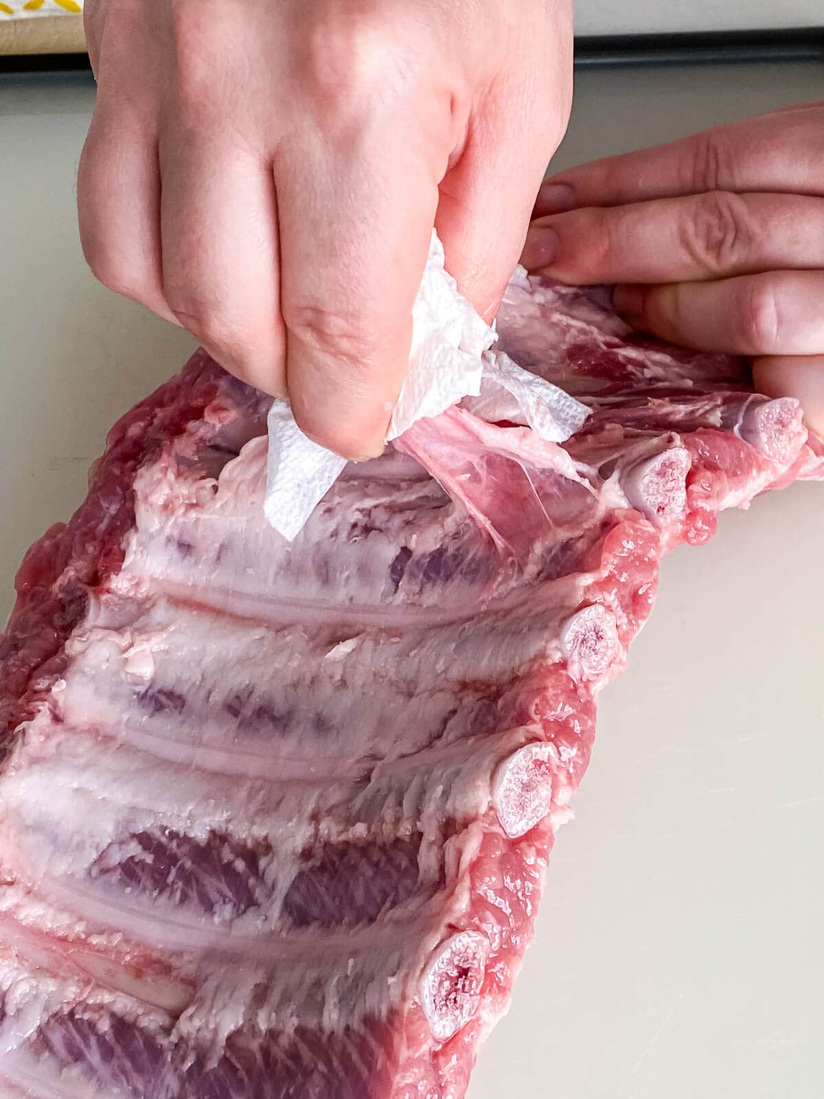 removing rib membrane with a paper towel.