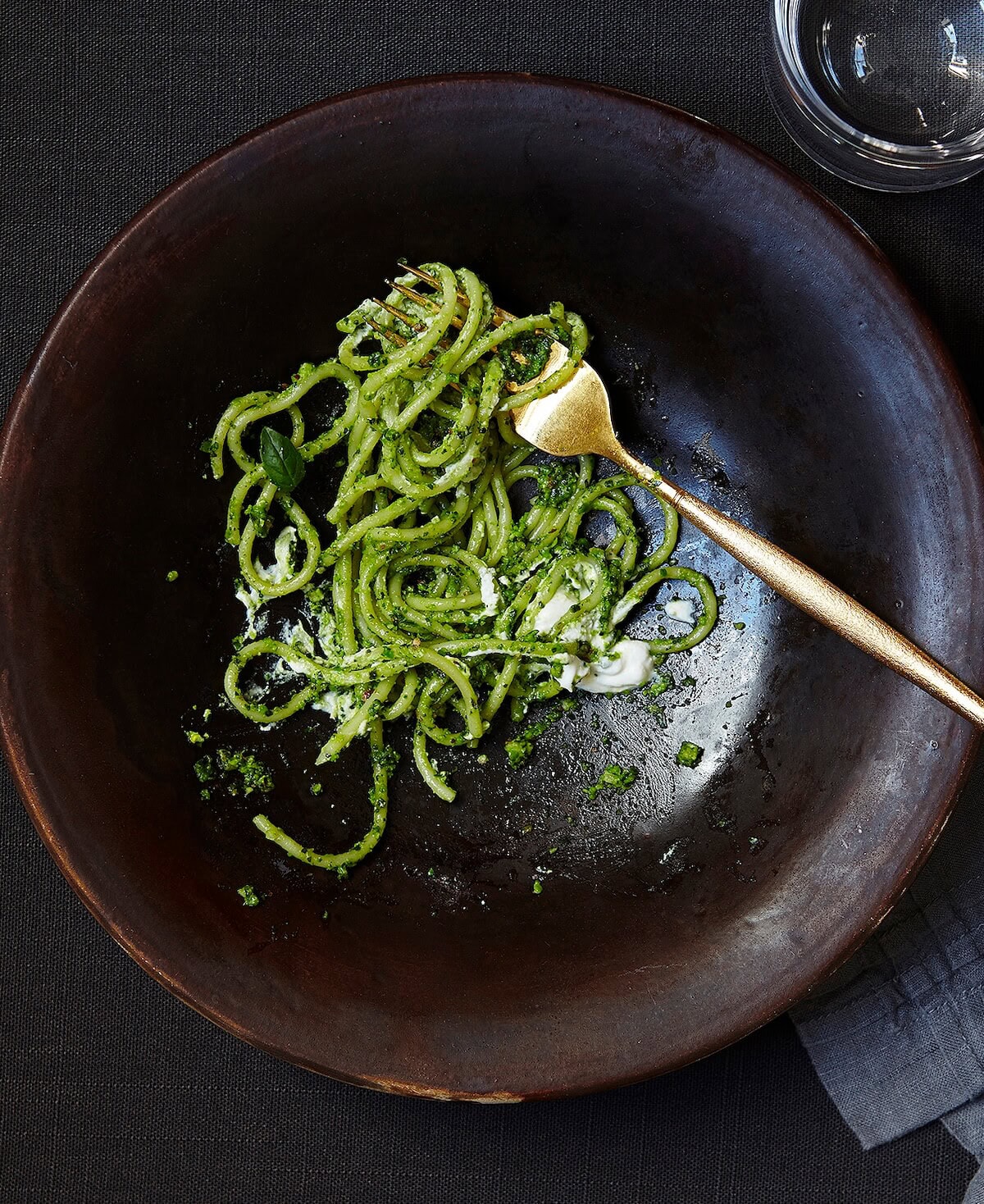 finished bowl of pesto pasta with lemon ricotta.