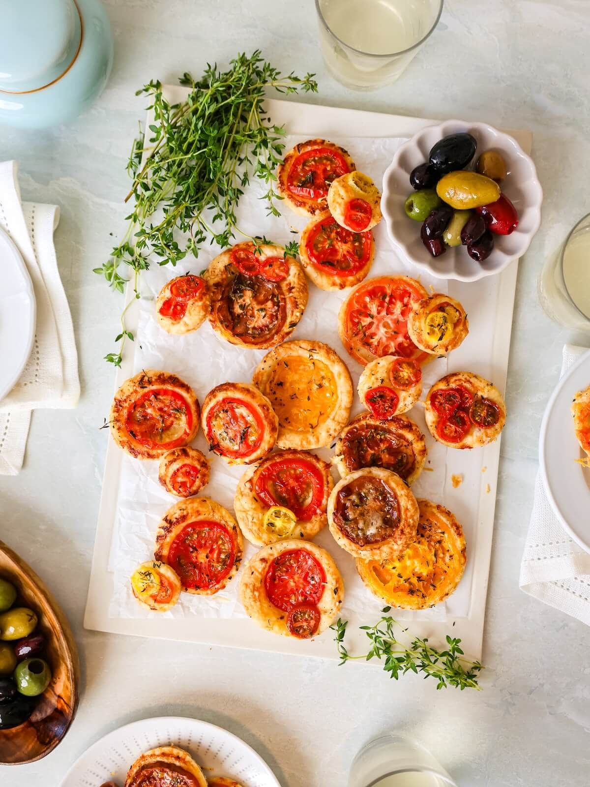mini tomato tarts on party table ready to serve to guests.