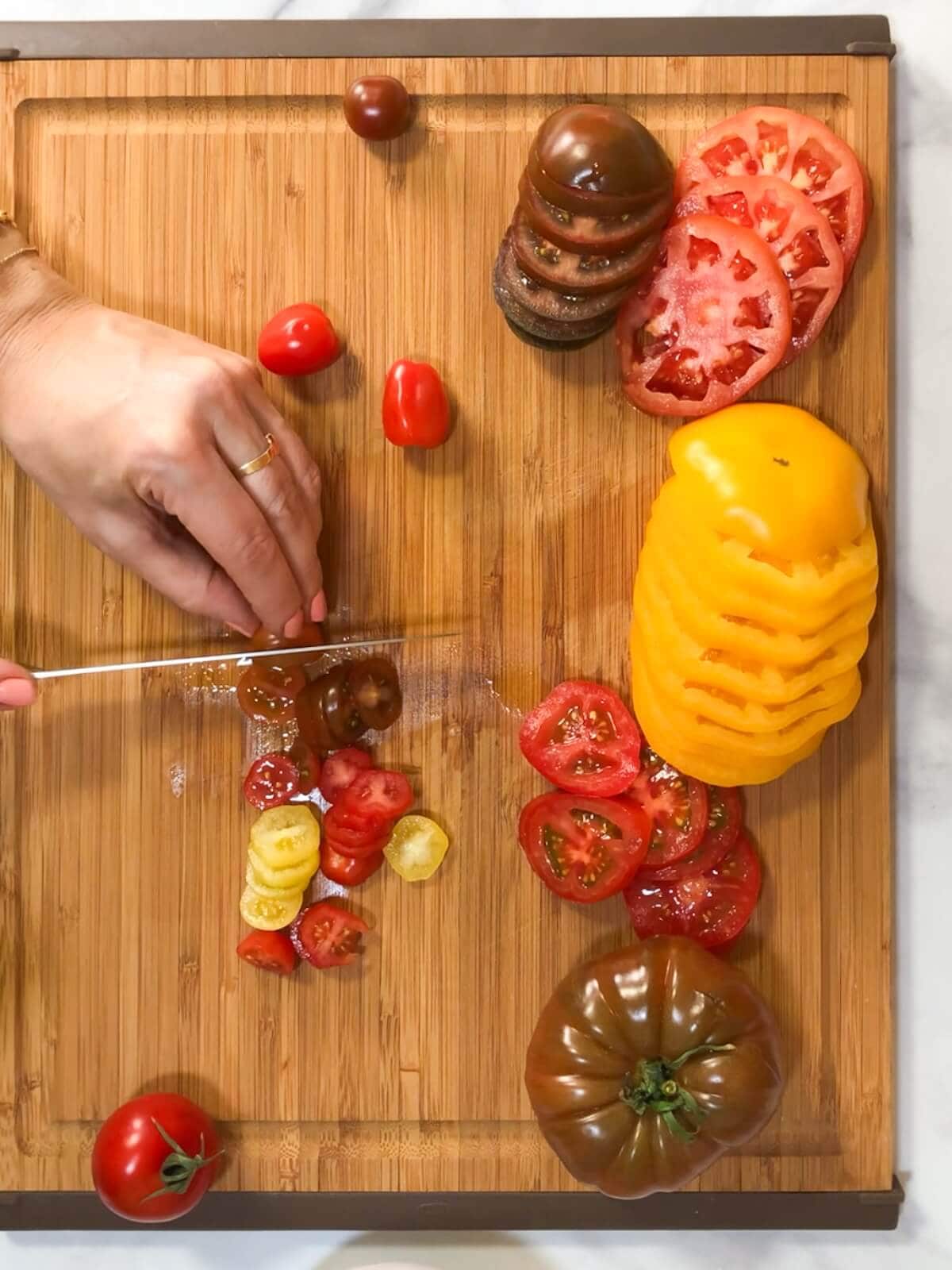 Slice tomatoes into thin rounds for tarts.