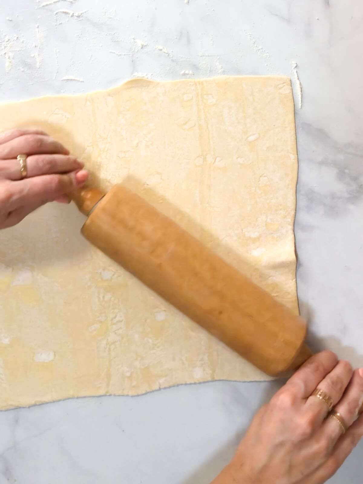Roll puff pastry sheet to 1/16 inch thick.