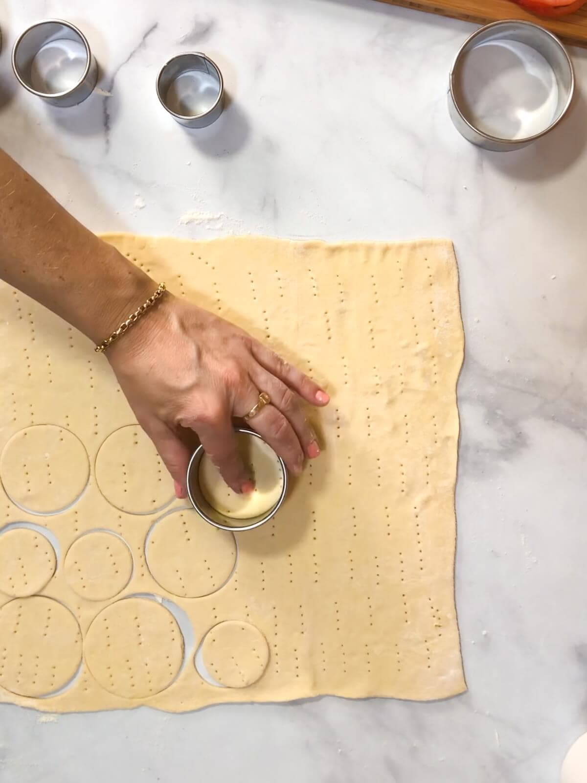 Cut varied sized rounds out of the puff pastry for the tarts.