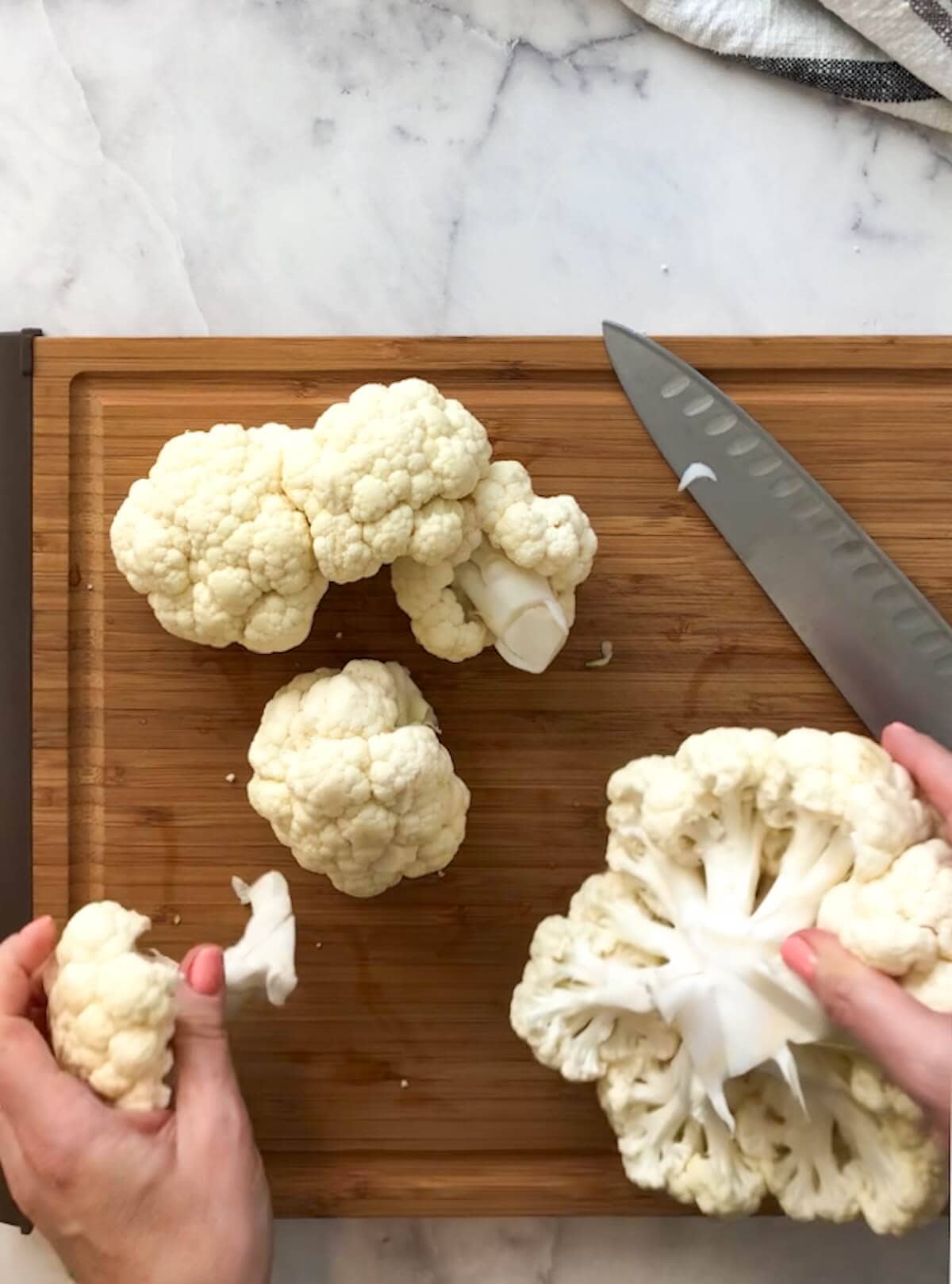 Cutting cauliflower into large florets for curry.
