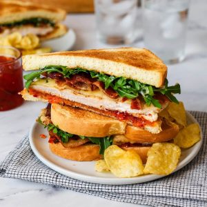 new feature image of a stack of chicken bacon sandwiches.