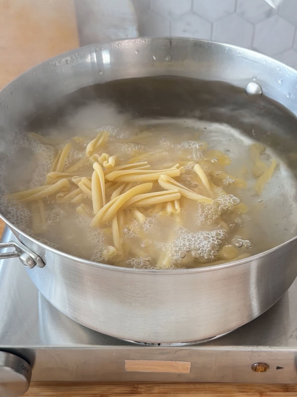 Cook pasta until al dente in salted water.