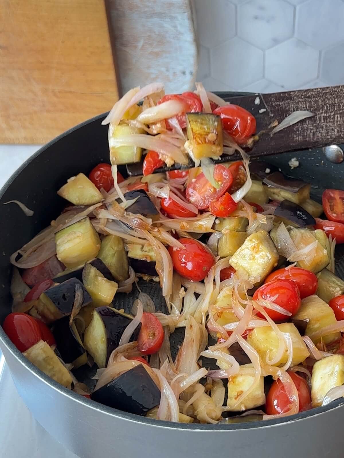 Cooking vegetables until just starting to turn golden brown.