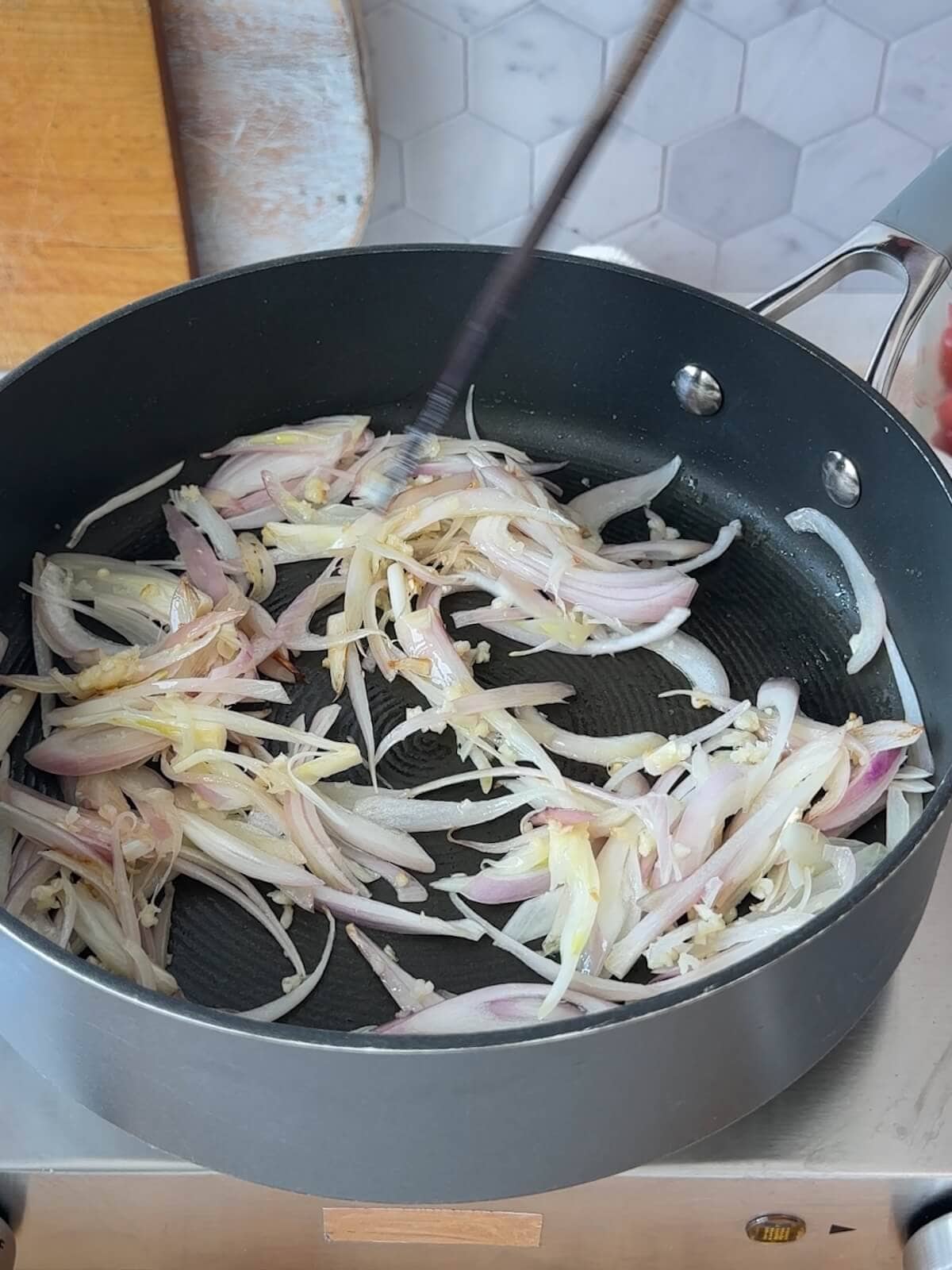 For eggplant pasta, saute shallots and garlic until soft.