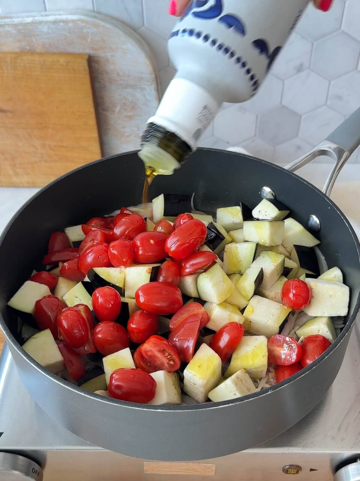 Add eggplant, tomatoes, salt, and olive oil to the skillet with the shallots.