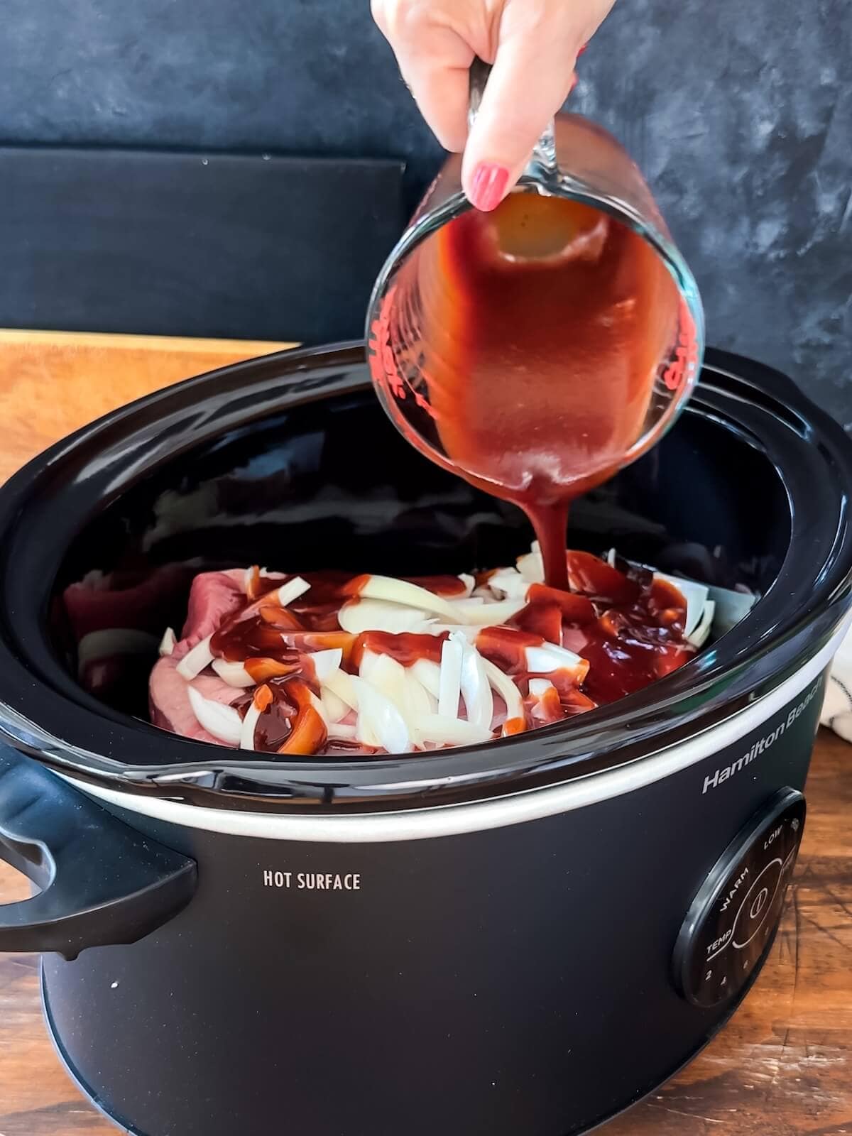 pour sauce over the brisket and onions and cook.