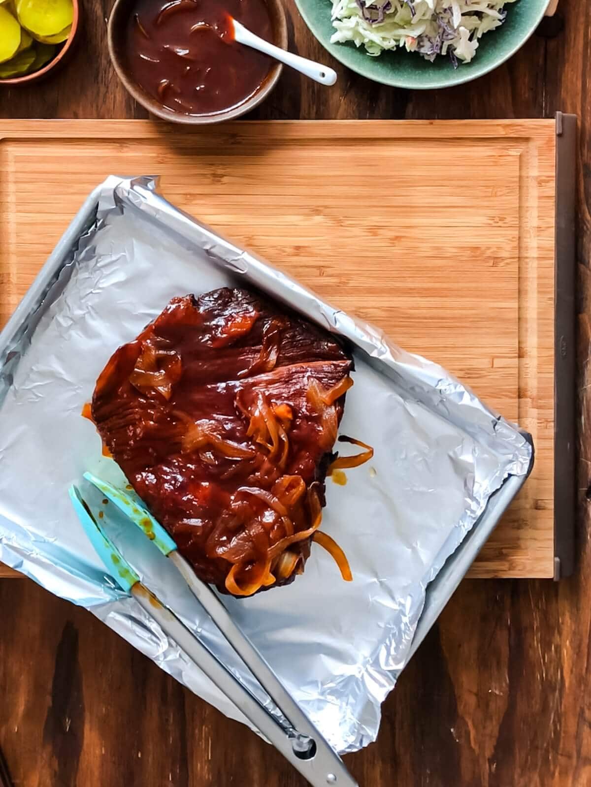 Cooked brisket resting before slicing.