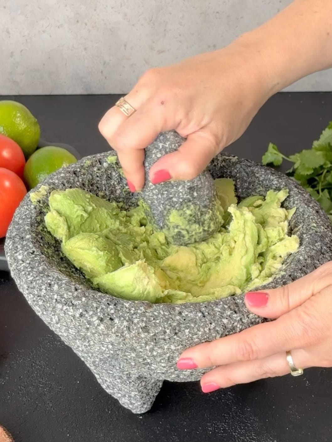 smashing avocado for guacamole