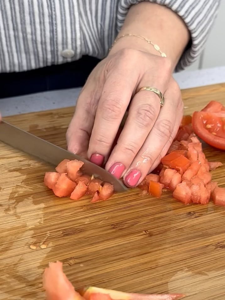 dicing seeded tomatoes for guacamole