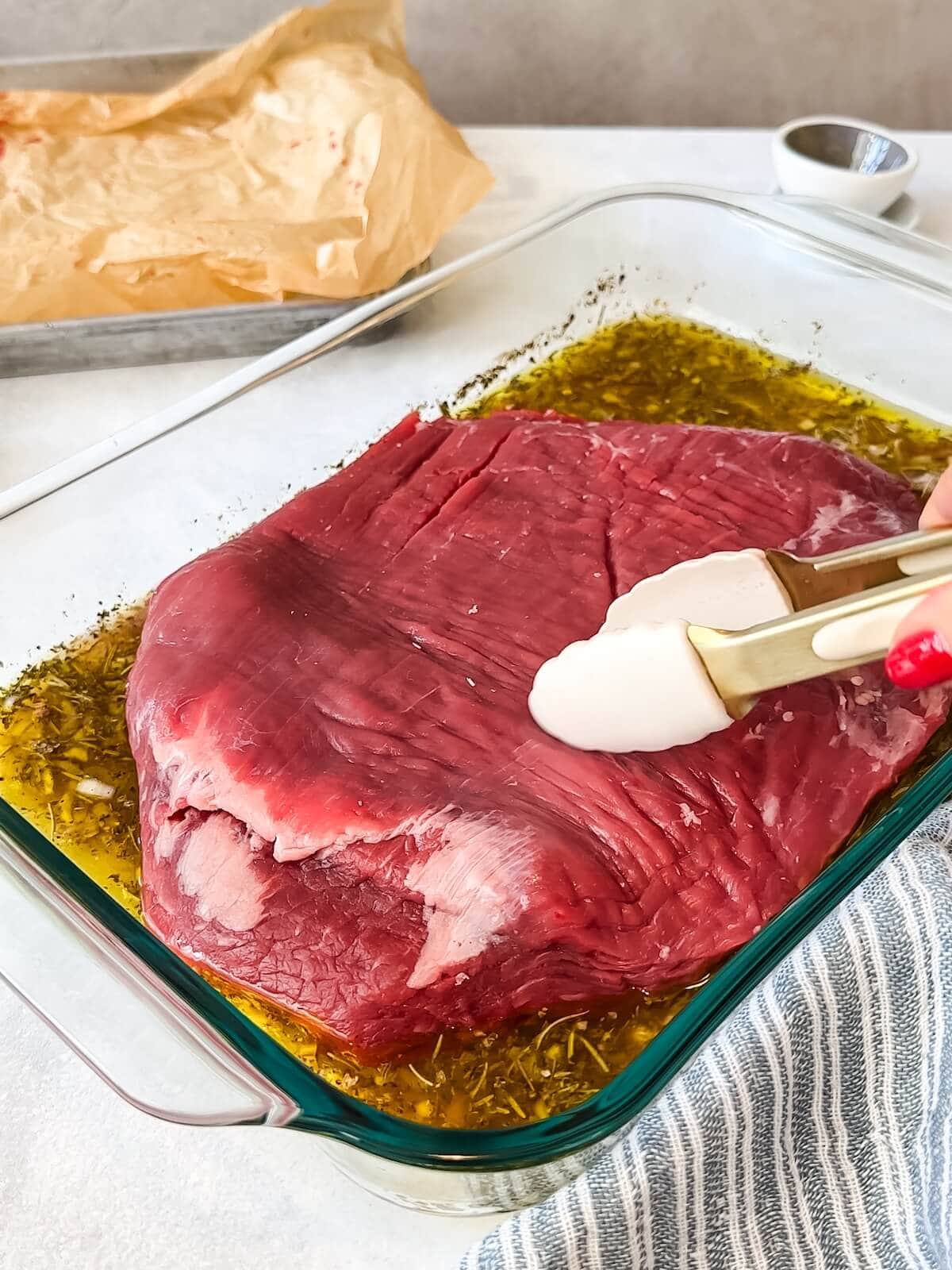 marinating flank steak in a glass dish