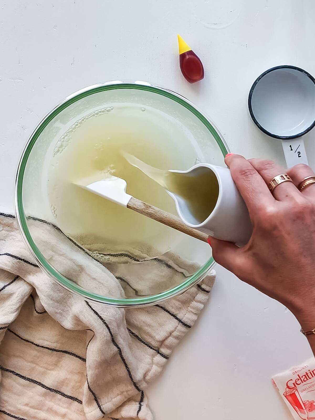 Adding lemonade to gelatine for lemon icebox pie.
