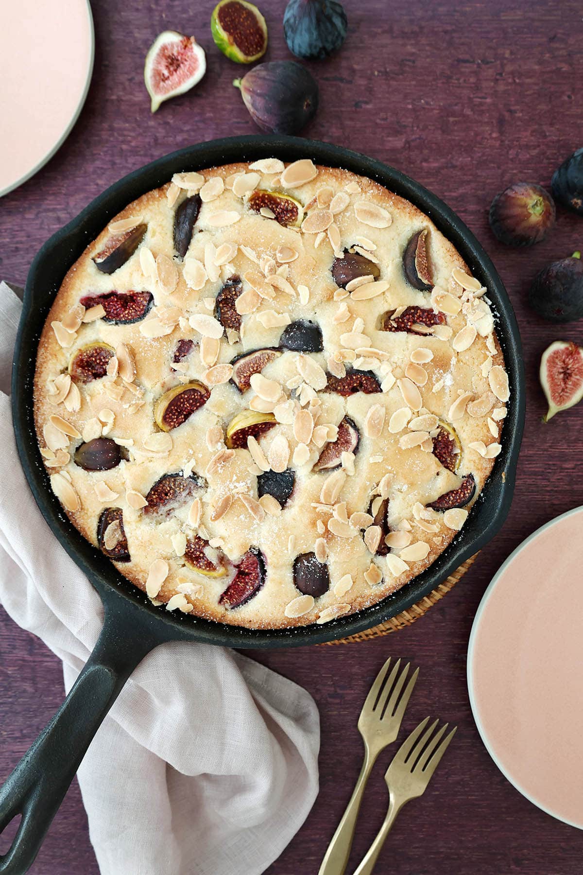 fig almond snack cake with fresh figs baked in a cast iron skillet ready to serve
