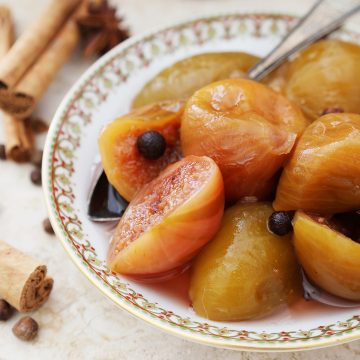 feature image of figs preserved in a sweet syrup in a bowl