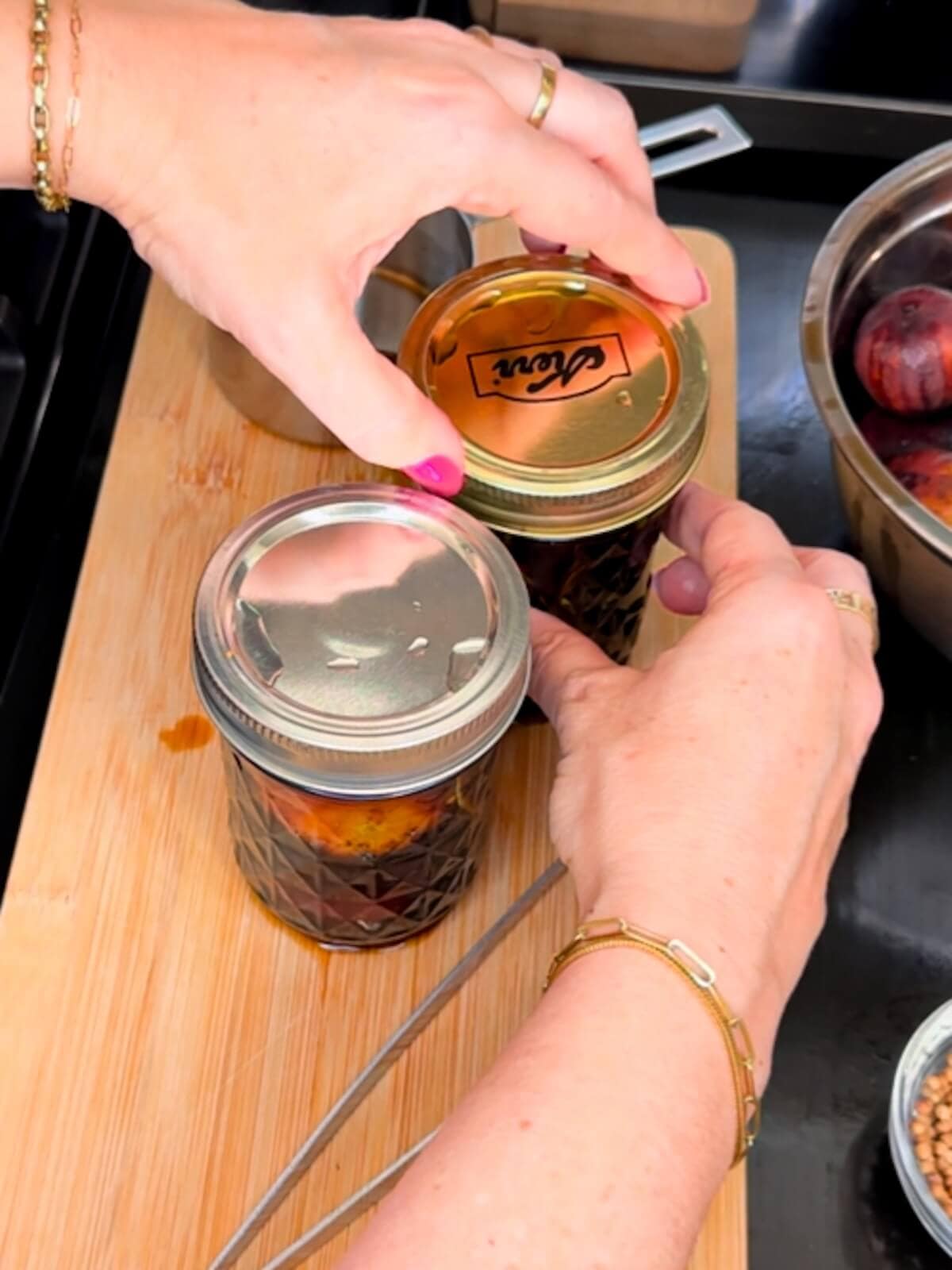 tightening ring lids on jars before preserving.