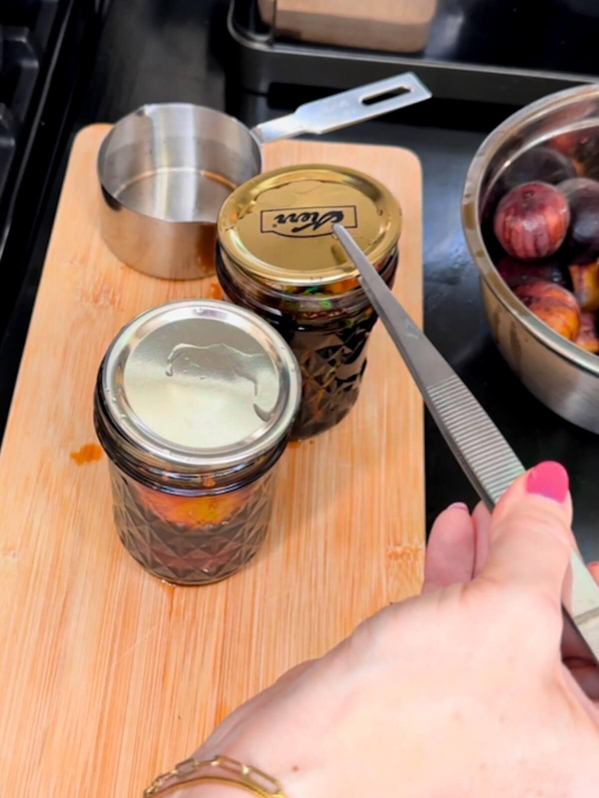 Topping jars with hot lids for preserving