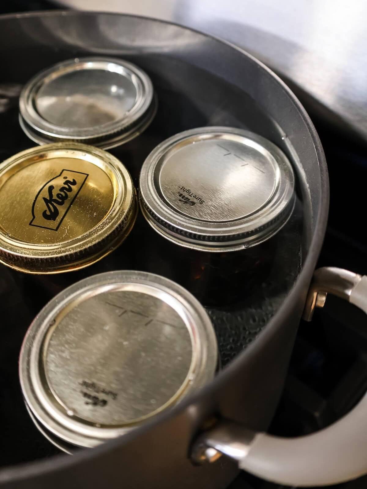 simmering sealed jars of figs to process.