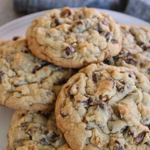 Plate of chocolate chip walnut cookies close up feature.
