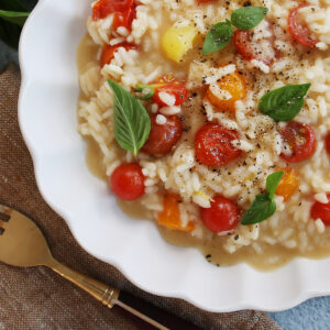 close version of tomato risotto in scalloped bowl, feature.