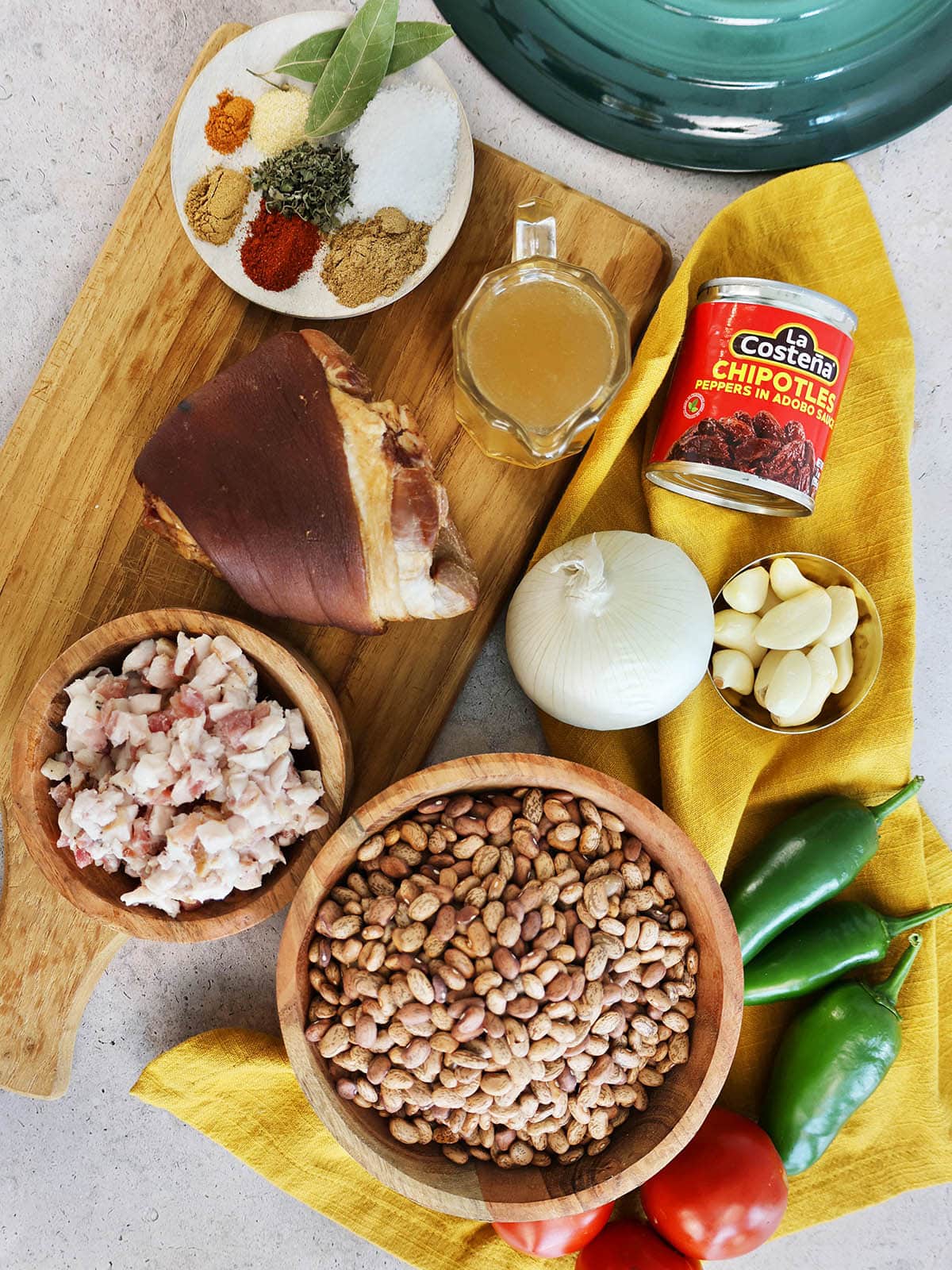 frijoles charro ingredients including ham hock, thick smoked bacon, pinto beans, and seasonings.