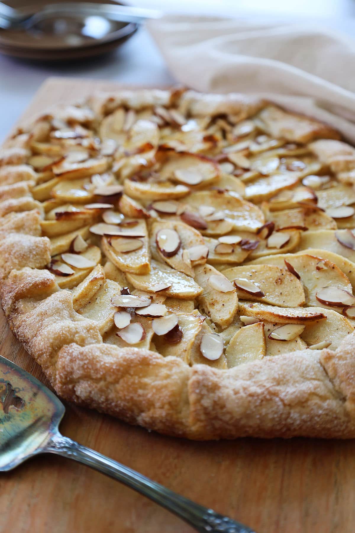 close up of apples baked into fragipane on apple tart.