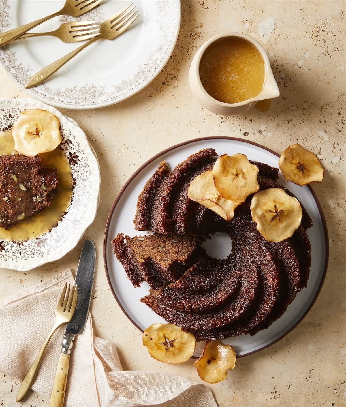 apple cake made in a tube pan with dried apple and butter sauce.