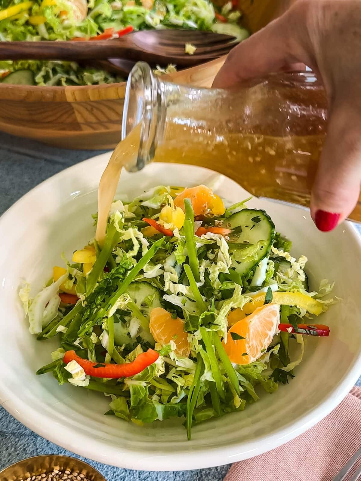 dressing salad for serving with ginger sesame dressing.