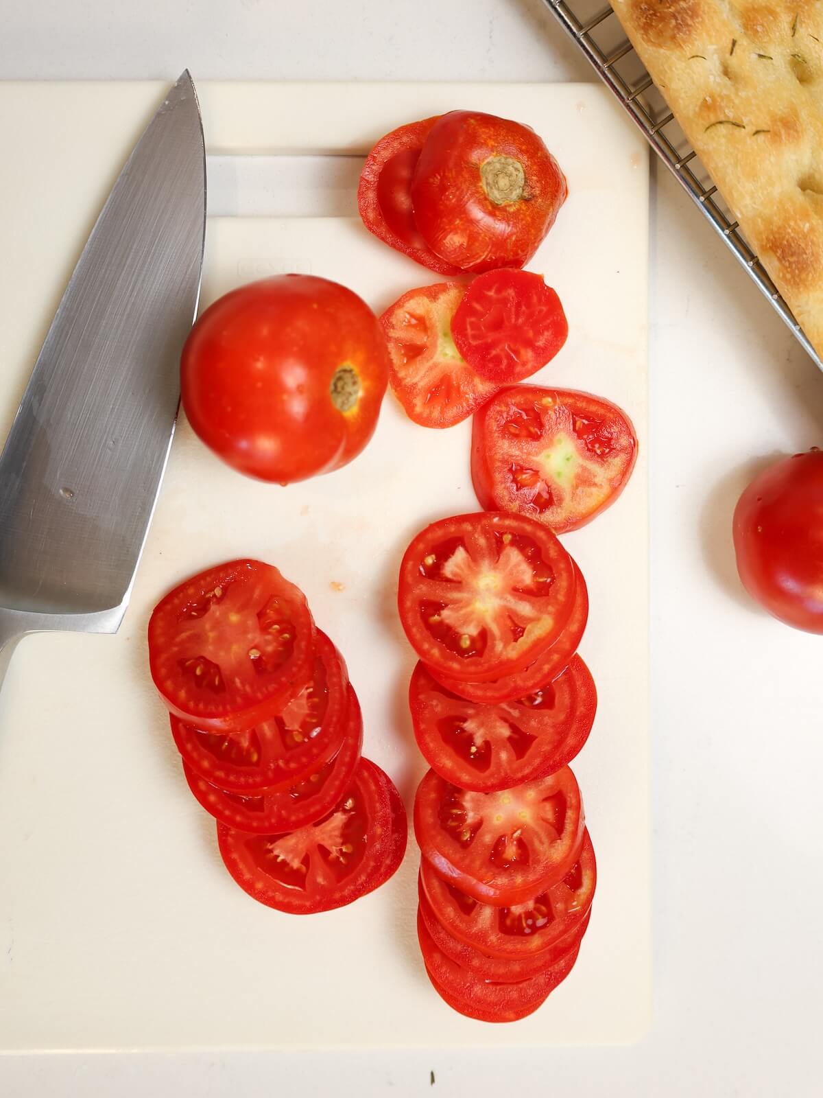 Slice tomatoes for caprese foccacia