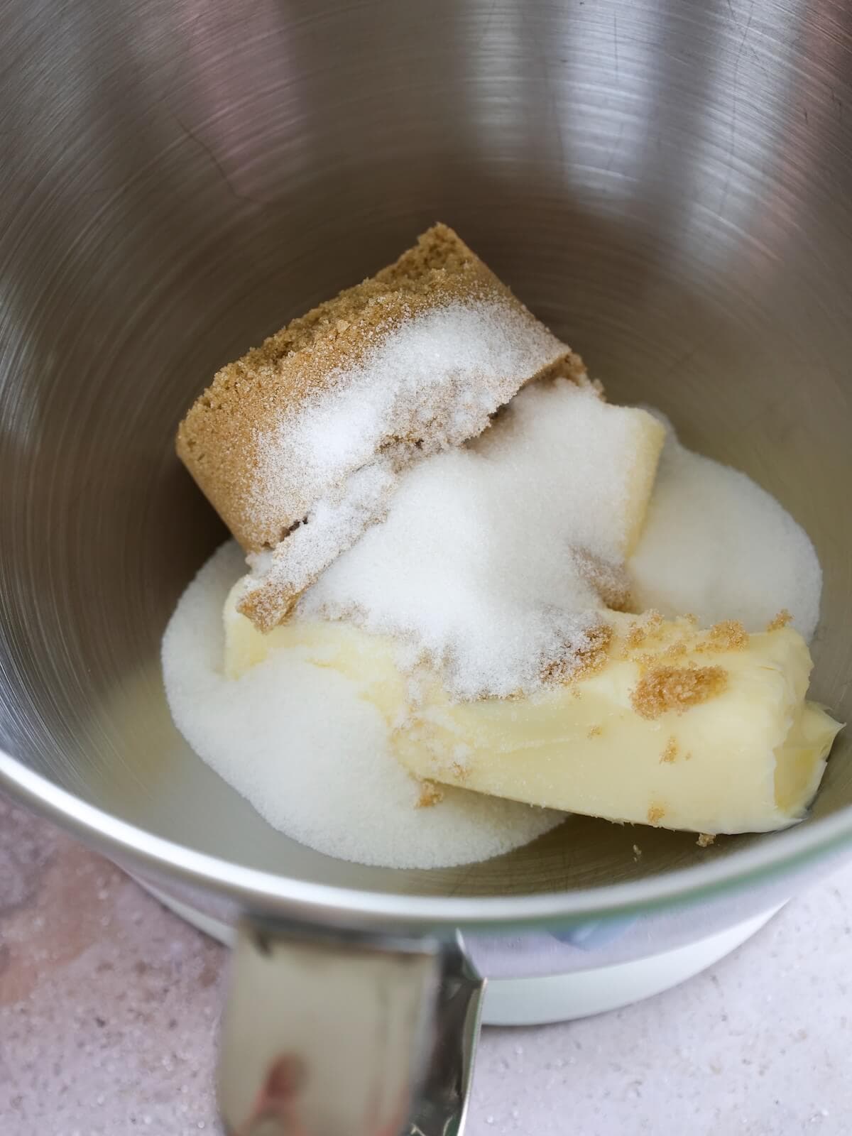 butter and sugars getting mixed for walnut chocolate chip cookies