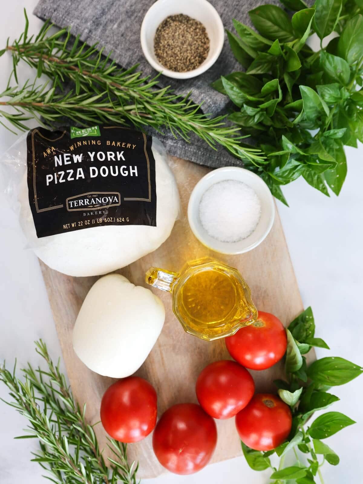 ingredients for caprese focaccia including store bought pizza dough.