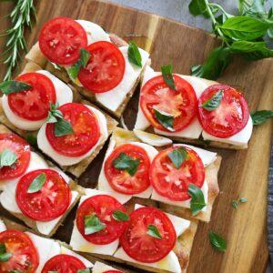 close up of caprese focaccia cut into portions