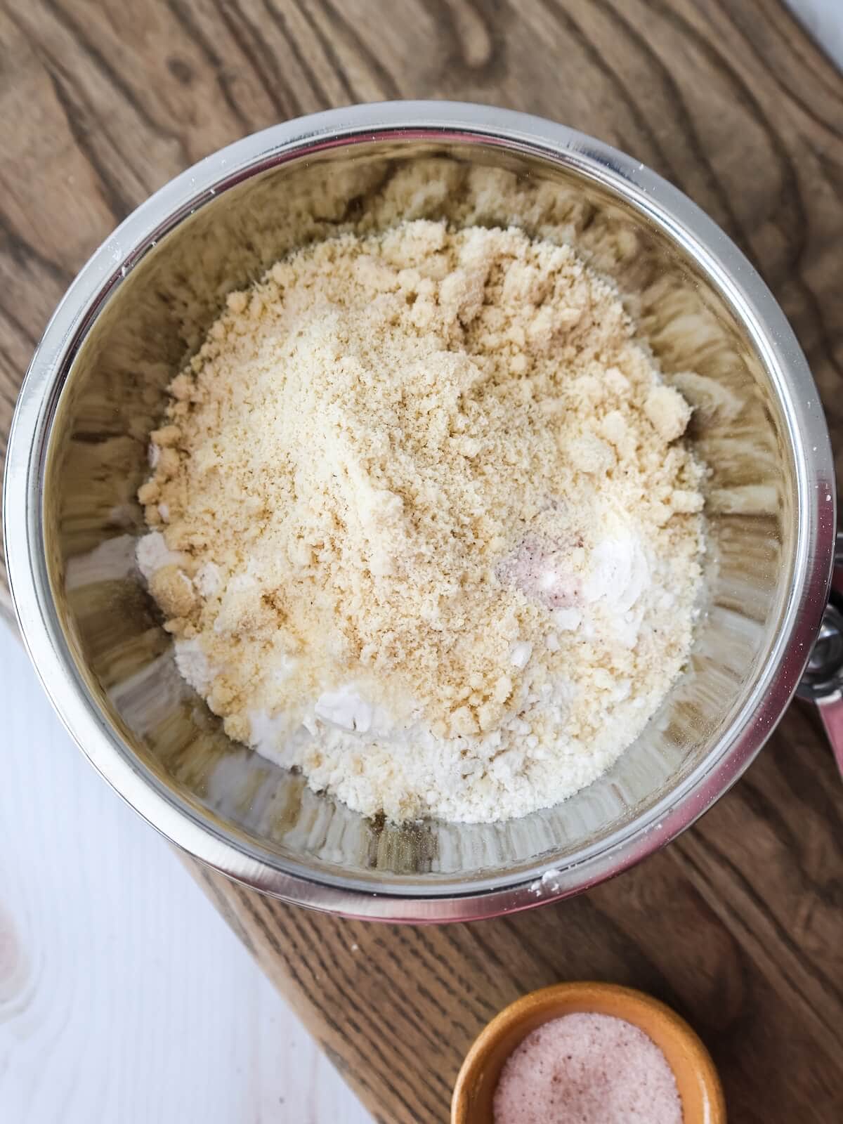 dry ingredients in a bowl for fig cake including flour and almond flour.