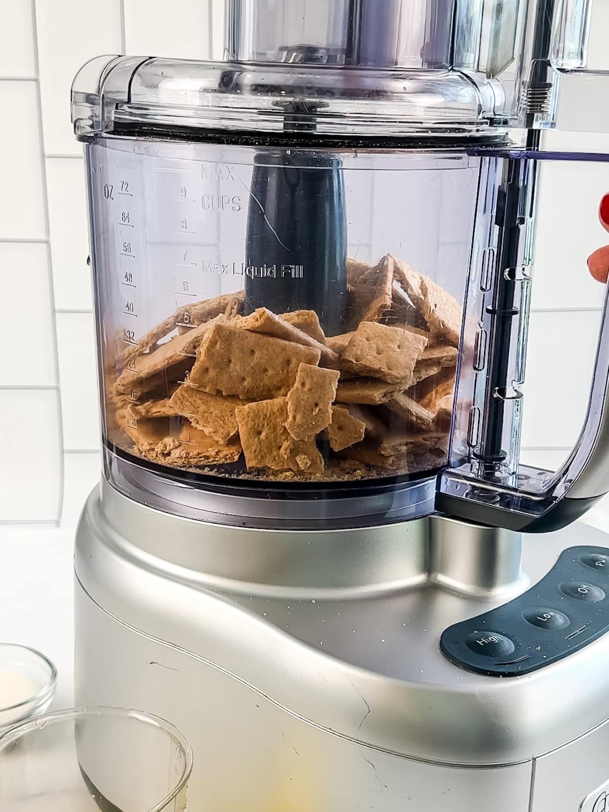 Graham crackers in a food processor for lime bars.