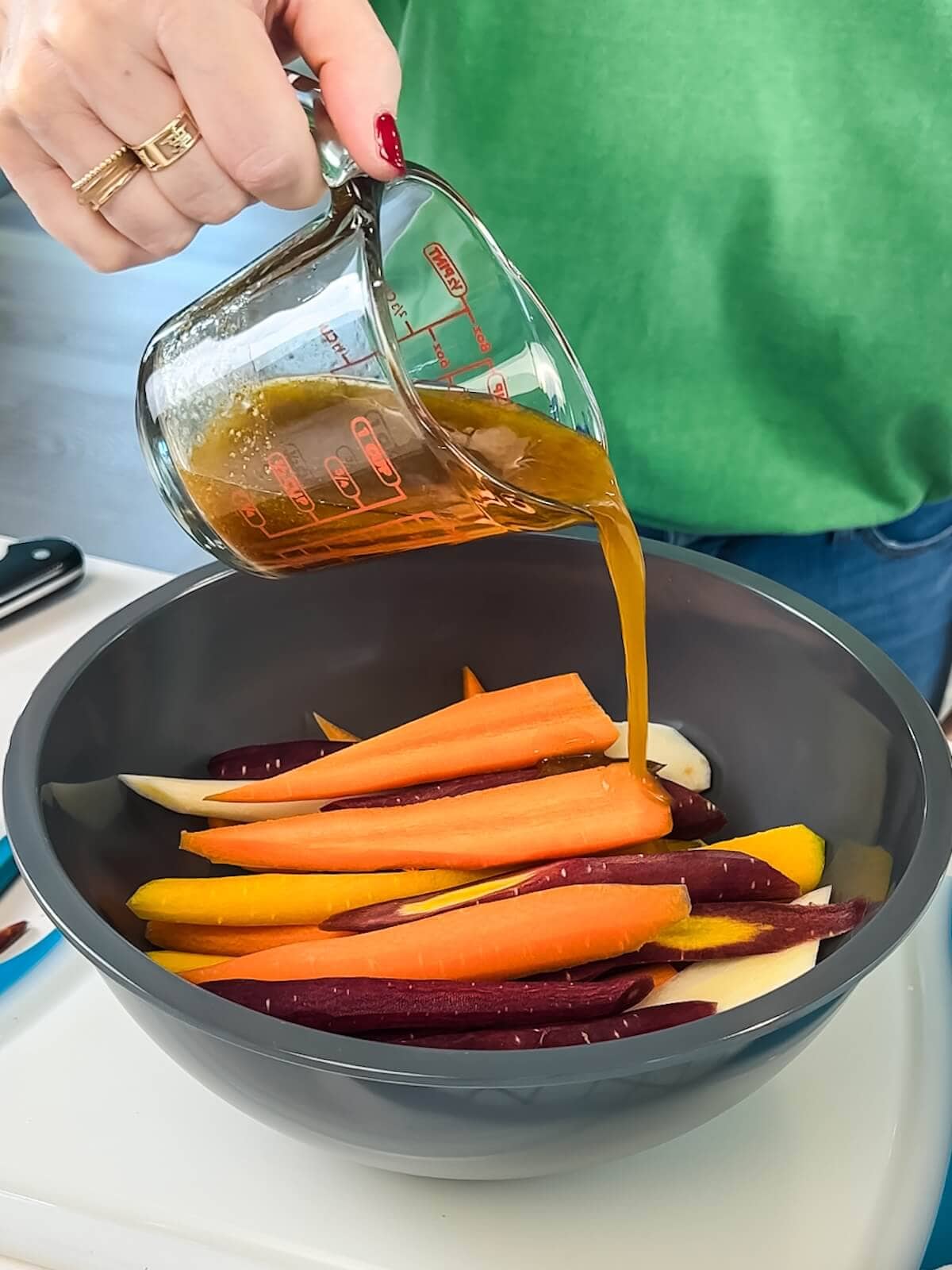 Drizzle half the vinaigrette over cut carrots before roasting for salad.