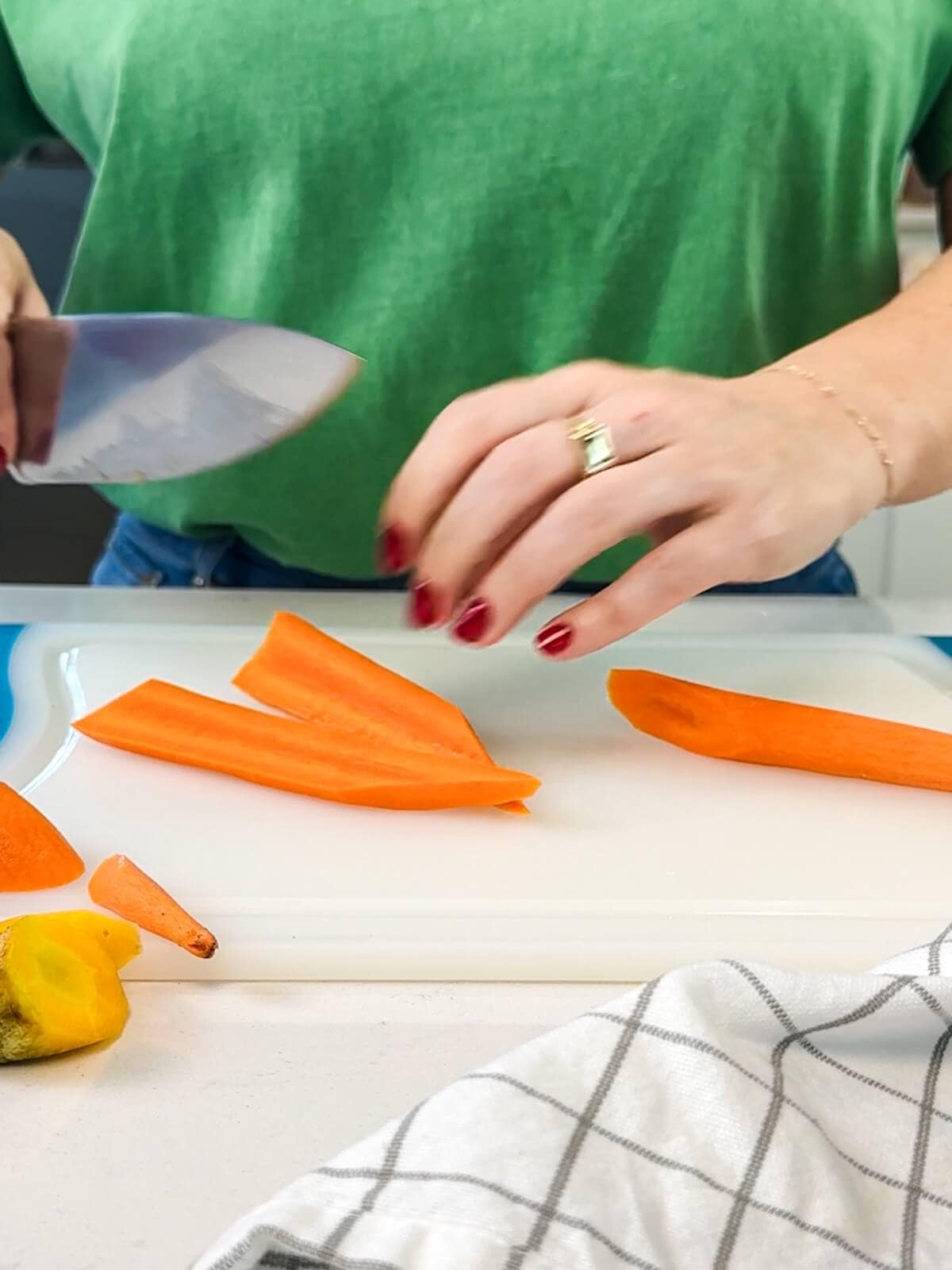 Cutting carrots into long thick strips for roasted carrot and beet salad.