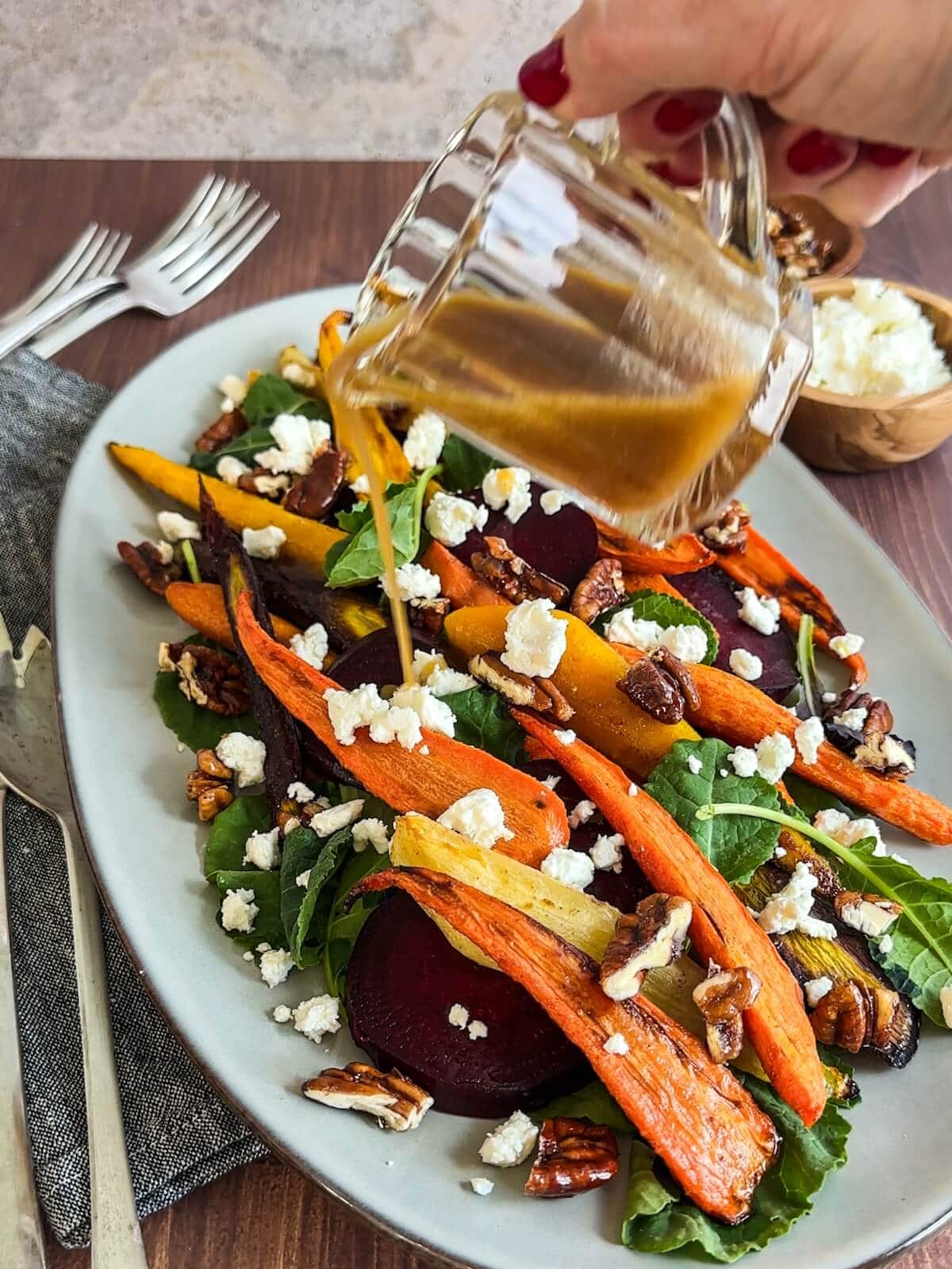 Dressing roasted beet and carrot salad with extra vinaigrette.