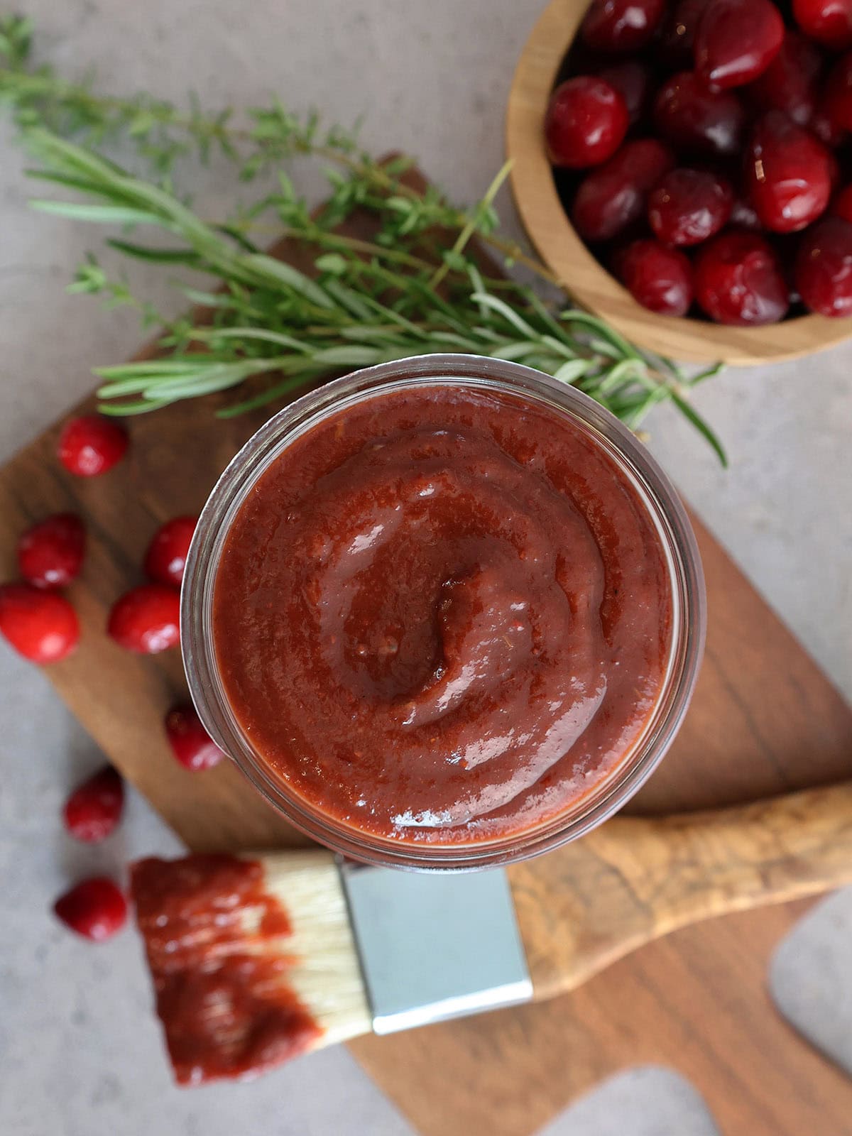Close up of the top of a jar of cranberry bbq sauce.