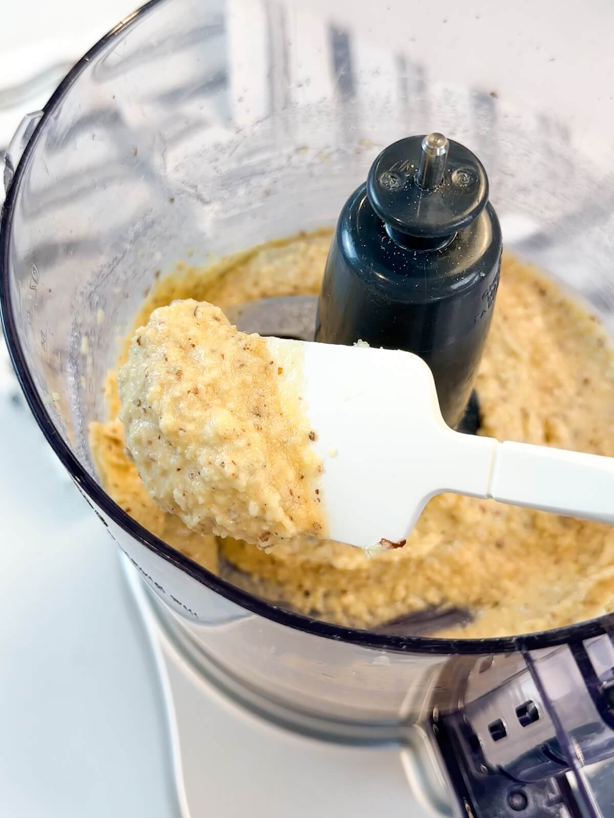 Spatula showing the consistency of prepared frangipane.