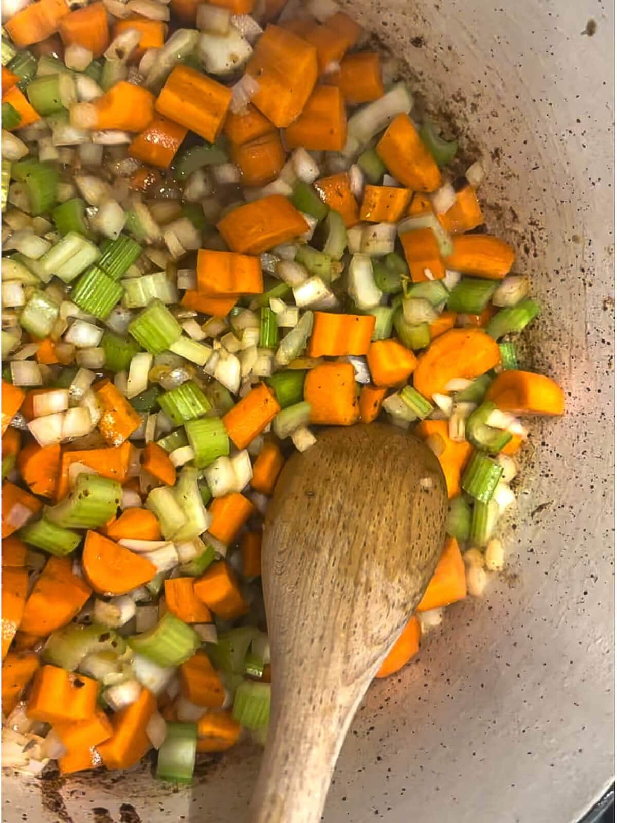 Cooking vegetables in Dutch oven for beef stew.