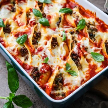 A baking dish filled with stuffed shells.