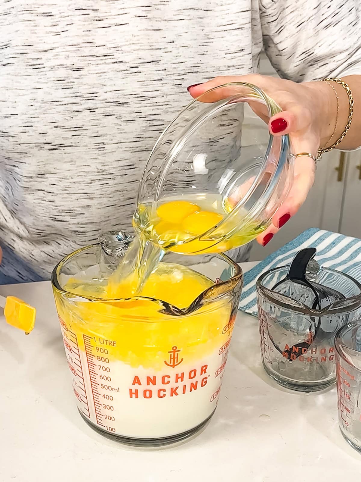 Mixing together liquid ingredients, honey, and eggs for soft sweet cornbread.