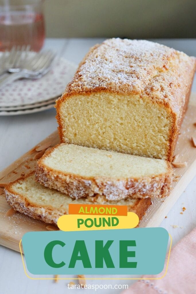 almond pound cake baked as a loaf sliced on a plate pin