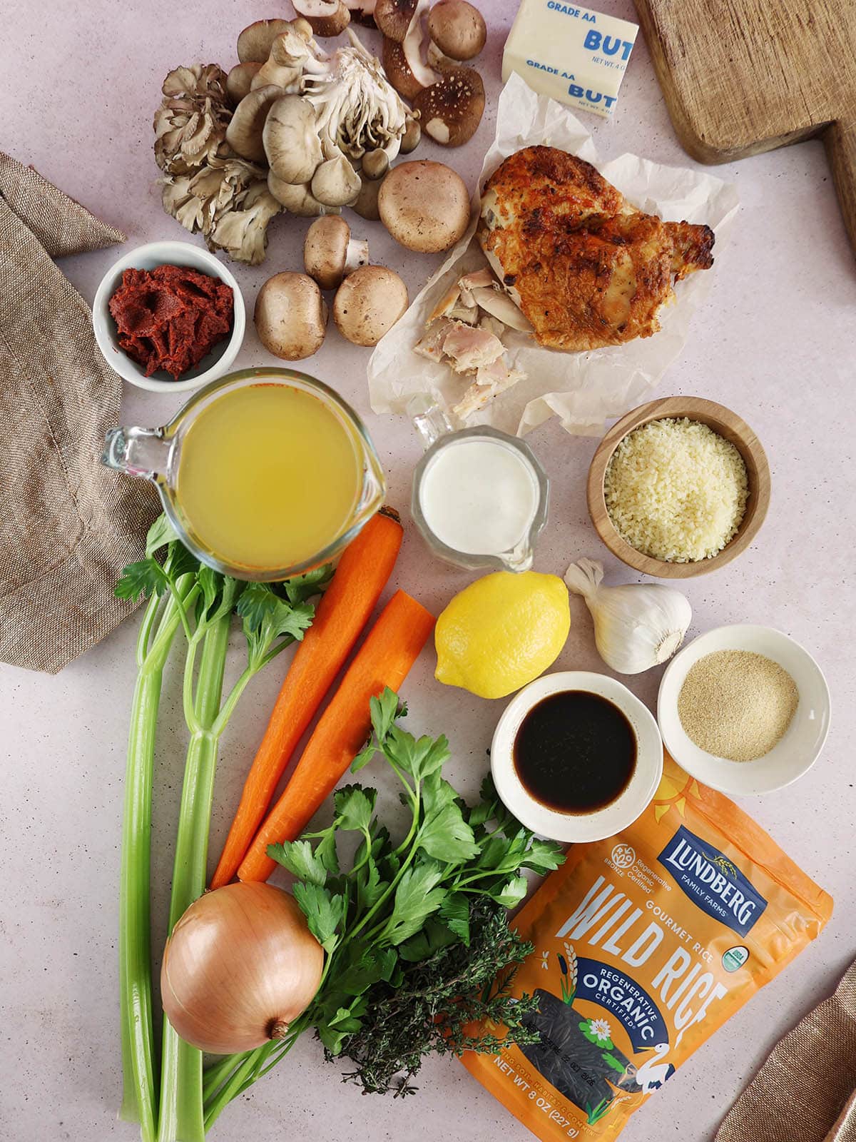 Top view of ingredients needed to make chicken, mushroom and wild rice soup.