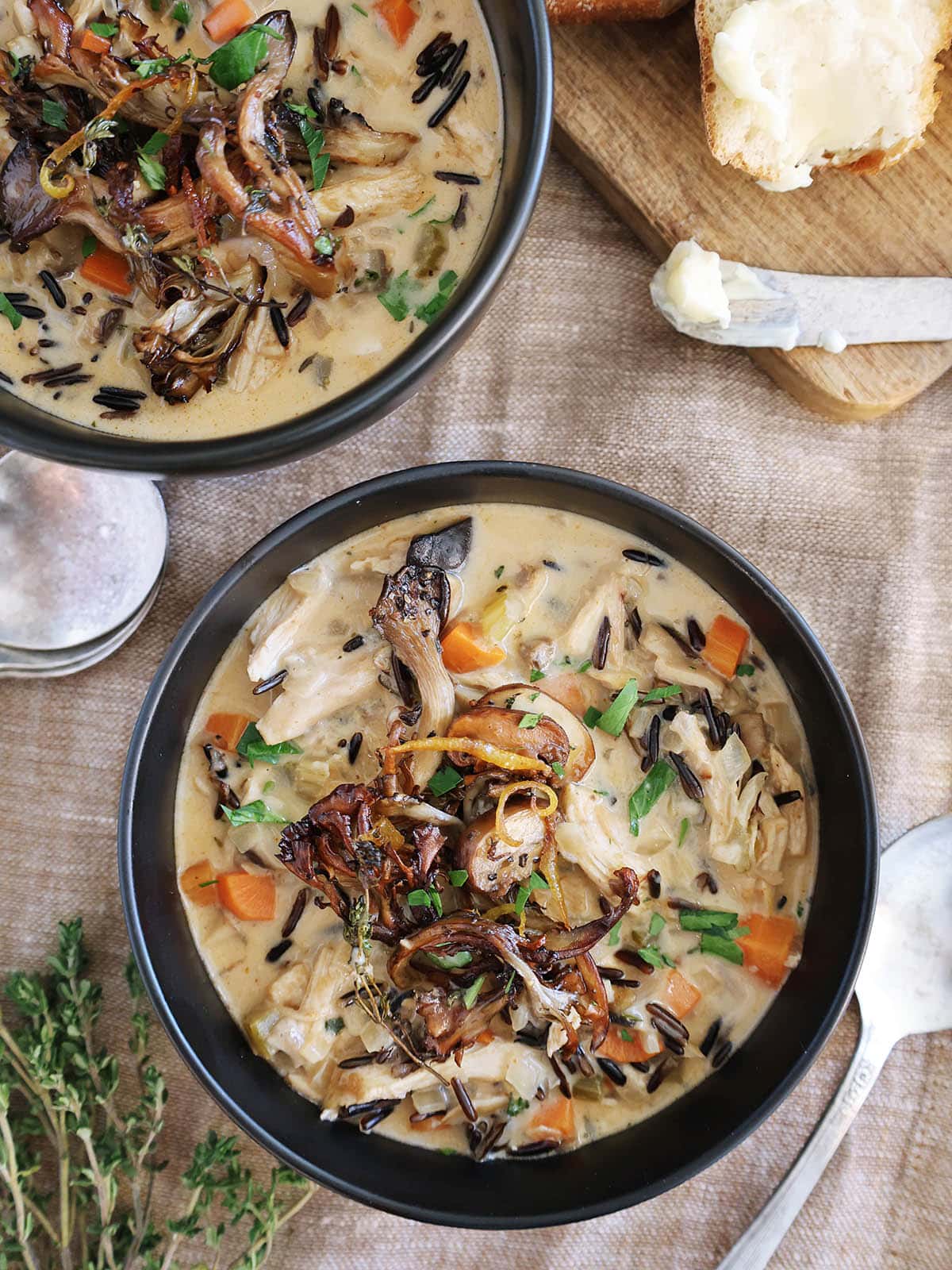 Top view of a bowl of chicken mushroom soup.