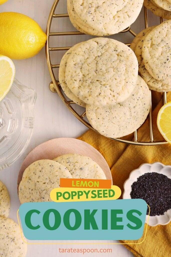 Fresh lemon poppy seed cookies on a cooling rack with lemon slices and poppy seeds.