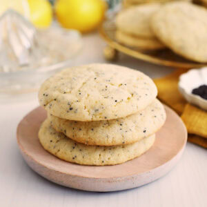 Close up of three stacked lemon poppyseed cookies.